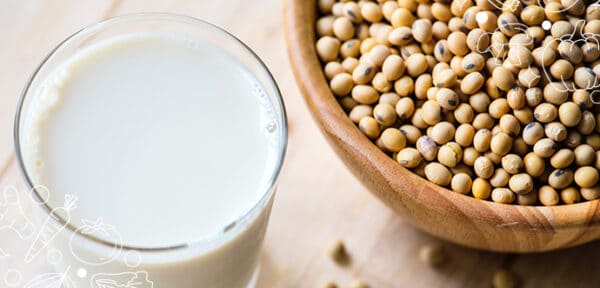 a bowl of beans and glass of milk